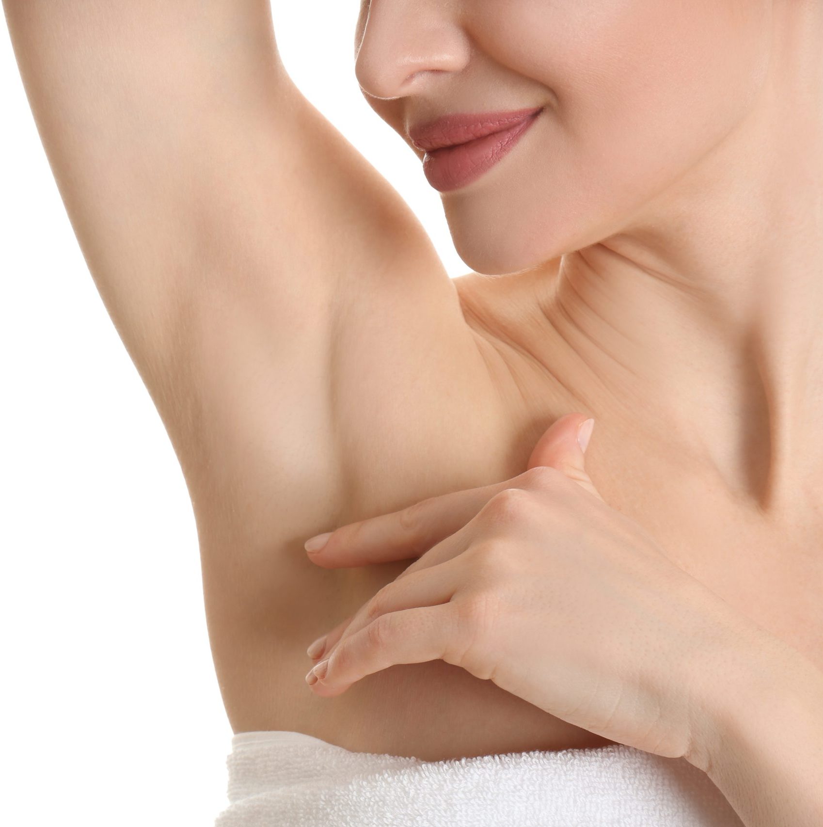 Young beautiful woman showing armpit with smooth clean skin on white background, closeup