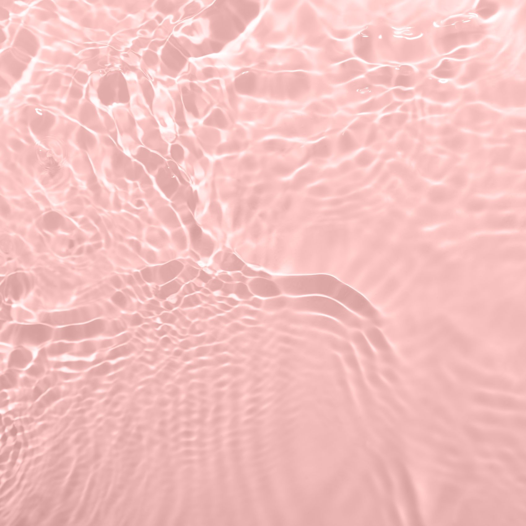 Fresh water background. Light pink pattern with natural rippled water texture. Top view with copy space. Cosmetic water surface background. Moisturizing, hydration concept