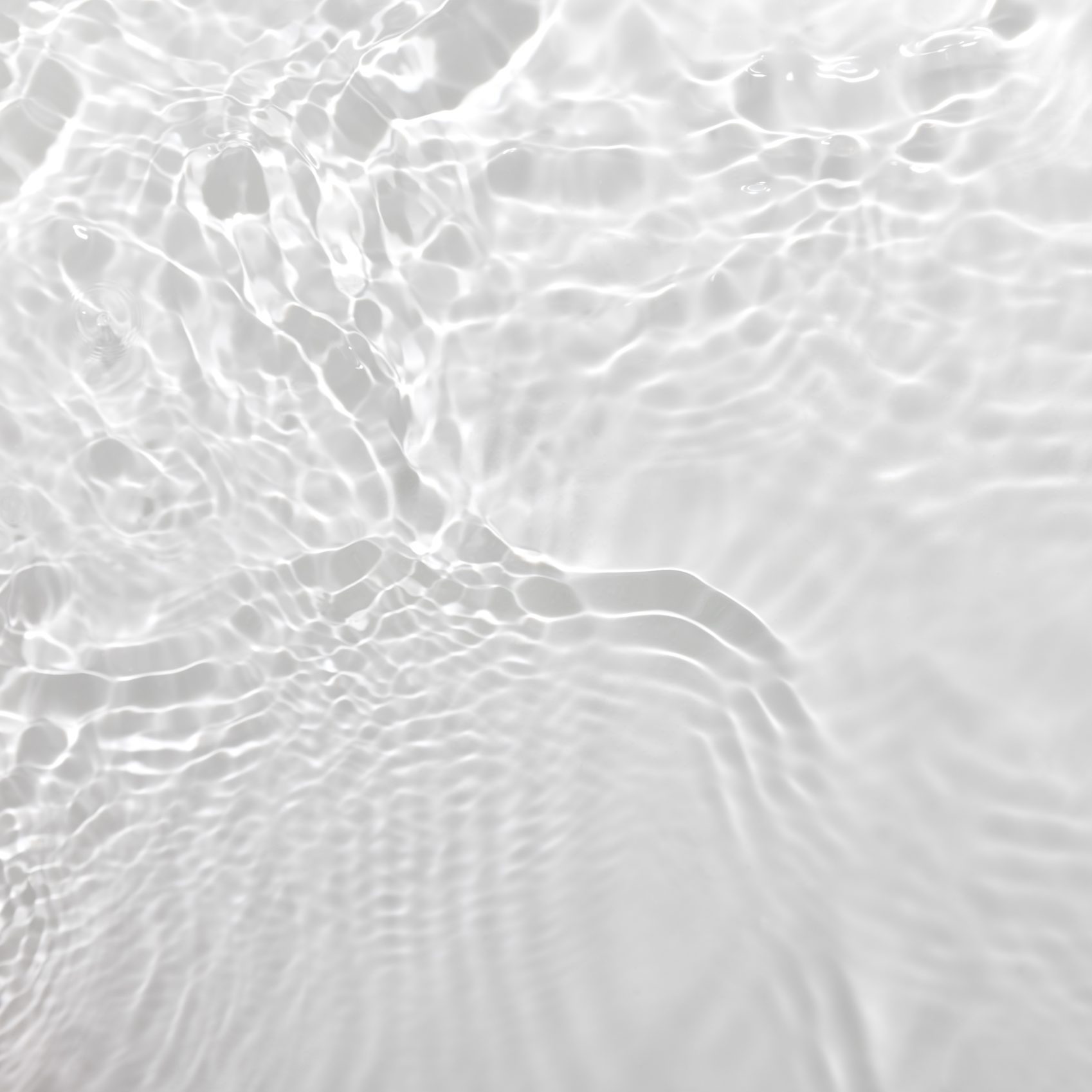 Fresh water background. Neutral white pattern with cleat rippled water texture and splashes. Top view, for color overlay